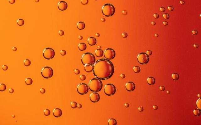 bubbles in orange liquid